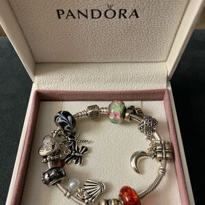 Pandora Silver Snake Chain Charm Bracelet with 13 elegant charms.